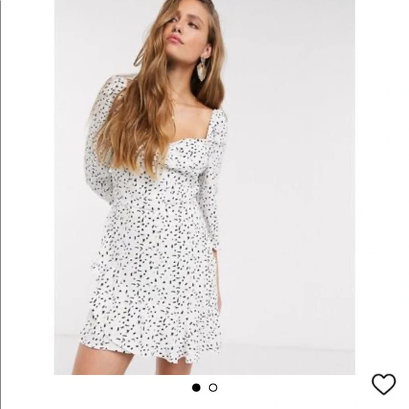 Elegant White and Black Polka Dot Mini Dress - Picture 2 of 8